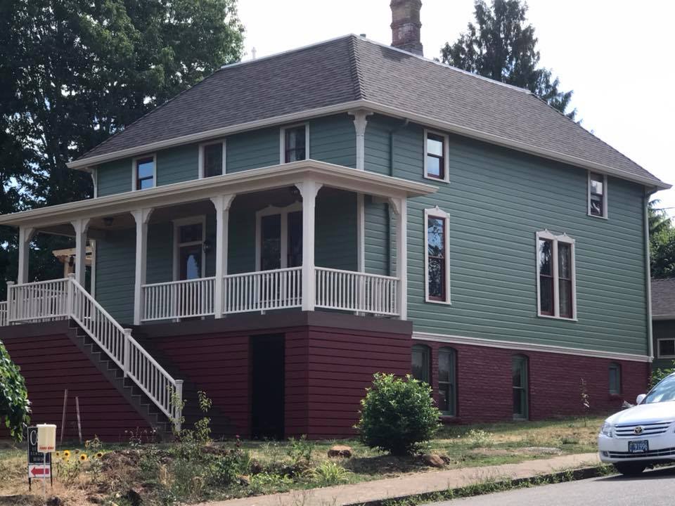 exterior painting brick and cladding house with railings and deck in Salem Keizer Oregon